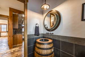 Bathroom featuring hardwood / wood-style floors and vanity