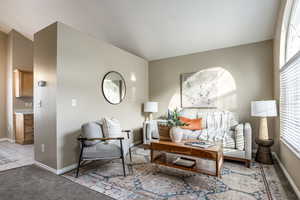 Sitting room featuring light colored carpet