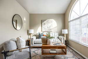 Living room featuring vaulted ceiling