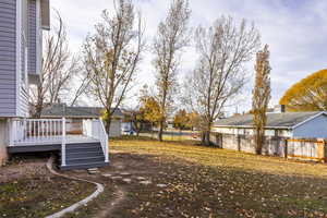 View of yard featuring a wooden deck