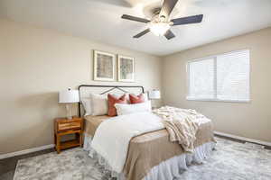 Bedroom featuring light carpet and ceiling fan