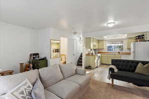 Living room with light hardwood / wood-style floors