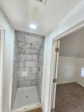 Bathroom with tiled shower