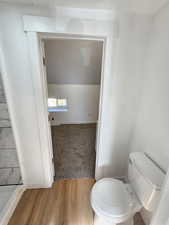 Bathroom featuring toilet and hardwood / wood-style flooring