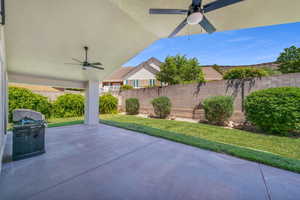 View of patio featuring ceiling fan