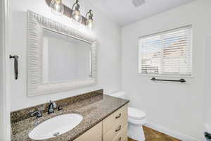 Bathroom with vanity and toilet