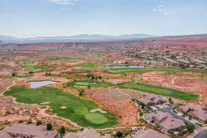 Drone / aerial view with a water and mountain view