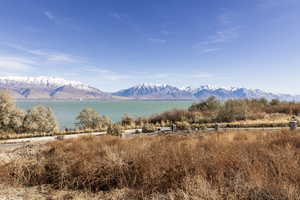 Property view of mountains with a water view