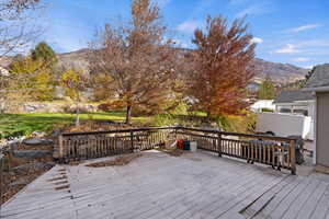 Wooden terrace featuring a mountain view