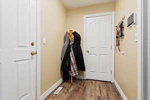 Doorway featuring light wood-type flooring