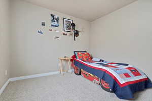 Bedroom featuring carpet floors