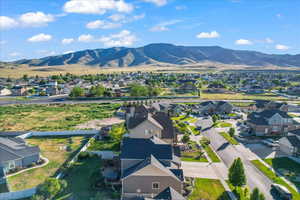 Birds eye view of property with a mountain view