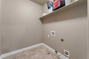 Laundry area with washer hookup and hookup for an electric dryer