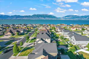 Drone / aerial view featuring a water and mountain view