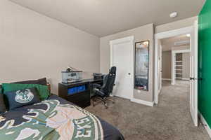 Bedroom with light colored carpet