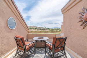 View of patio / terrace featuring a mountain view and a balcony