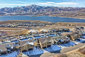 Drone / aerial view featuring a water and mountain view