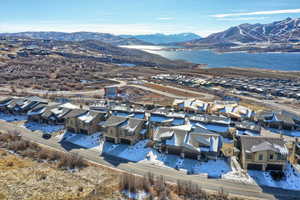 Drone / aerial view with a water and mountain view