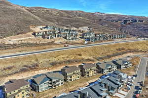 Birds eye view of property with a mountain view