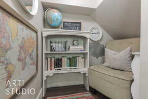 Sitting room with dark hardwood / wood-style flooring