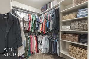 Walk in closet featuring carpet flooring