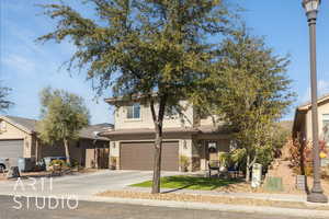 View of front of property featuring a garage