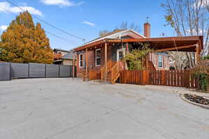 View of front facade with a carport