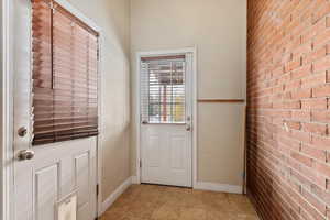 Entryway with brick wall