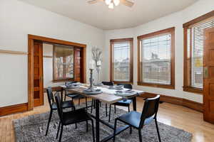 Dining area featuring ceiling fan, a healthy amount of sunlight, and light hardwood / wood-style flooring