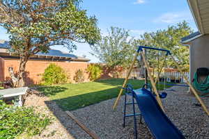 View of yard featuring a playground