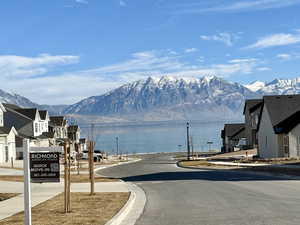 View of street featuring a water and mountain view