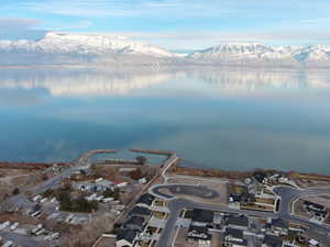 Drone / aerial view with a water and mountain view