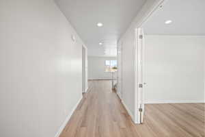 Hallway featuring light hardwood / wood-style flooring