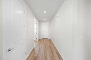 Hallway with light wood-type flooring