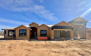 View of front of home featuring a garage