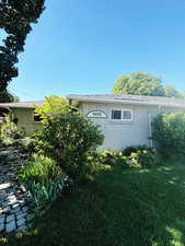 View of home's exterior featuring a yard