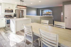 Dining area view towards kitchen, stairs to LR and overlook wall. Pics do not do it justice.