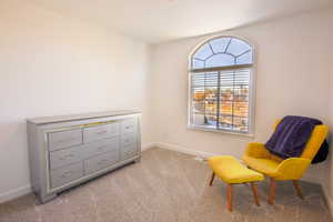 Bedroom 2 of 3 up. Sitting room or office.  with light colored carpet, nice view