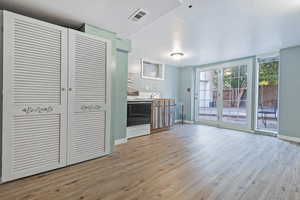 Unfurnished living room featuring light hardwood / wood-style flooring