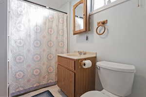 Bathroom with vanity and toilet