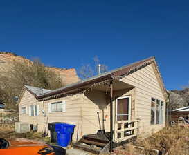 View of front of home featuring central air condition unit