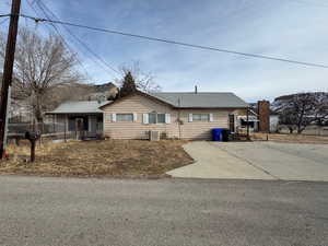 Single story home featuring cooling unit