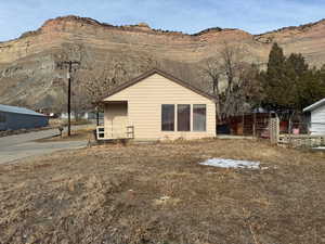 Rear view of property with a mountain view