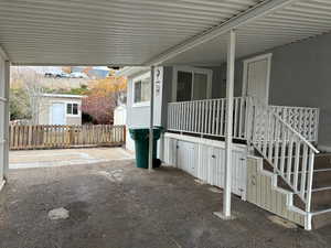 View of patio featuring a carport