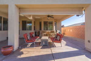 View of patio featuring ceiling fan