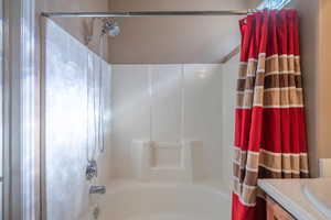 Bathroom with vanity and shower / tub combo