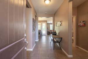 Interior space featuring light tile floors and a textured ceiling