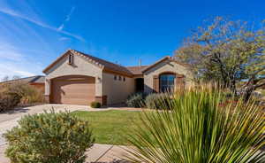 View of front facade with a garage and a front yard