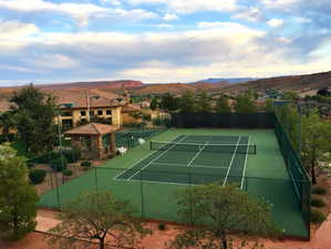 View of tennis and pickleball courts with a mountain view