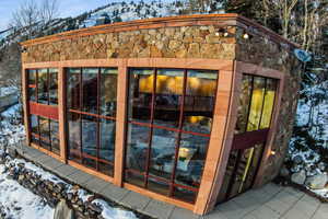 Snow covered structure featuring a mountain view